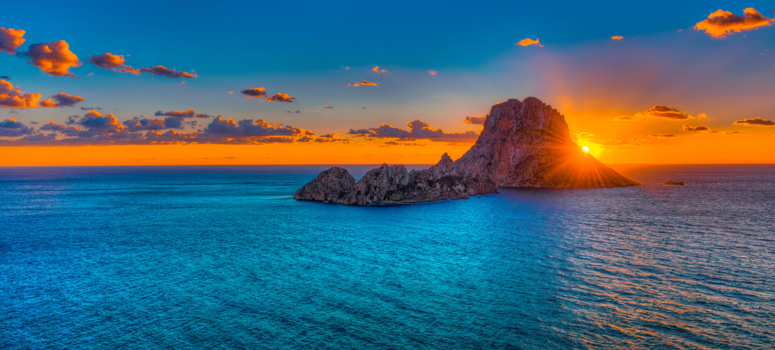 Es Vedra sunset from the sea on a Riva Perseo 76 Ibiza yacht charter